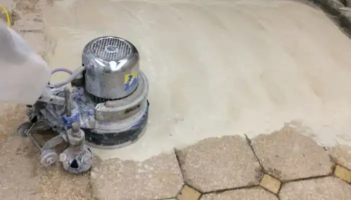 Professional terrazzo floor resurfacing using controlled grinding and honing